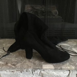 Black thigh-high heeled boots